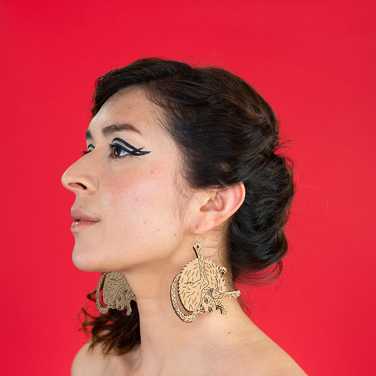 large wood cat earrings on model