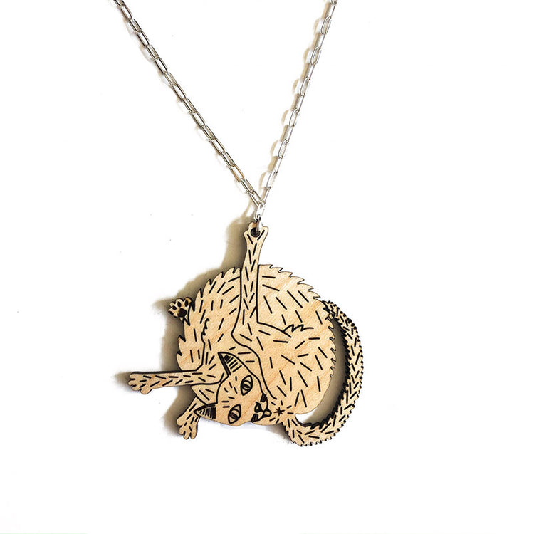 wood cat necklace over white background