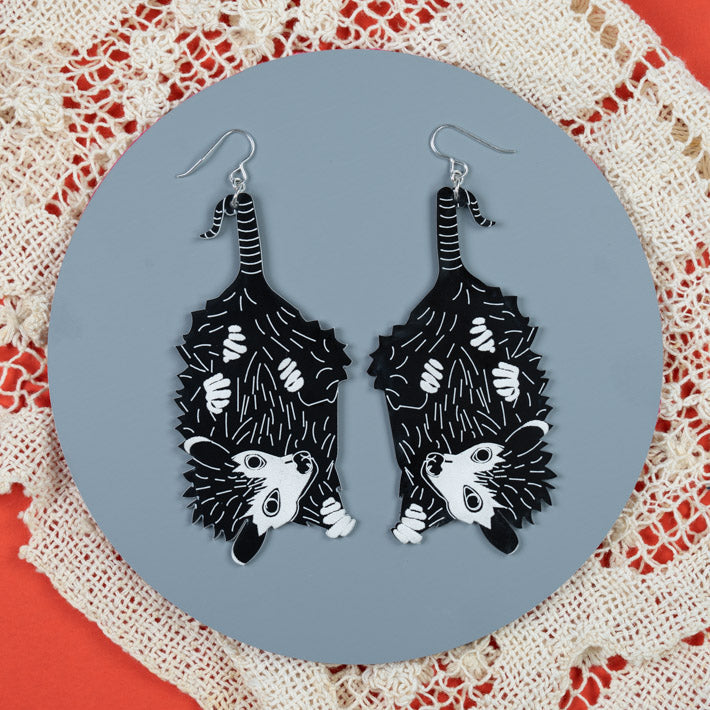 Large baby possum earrings styled