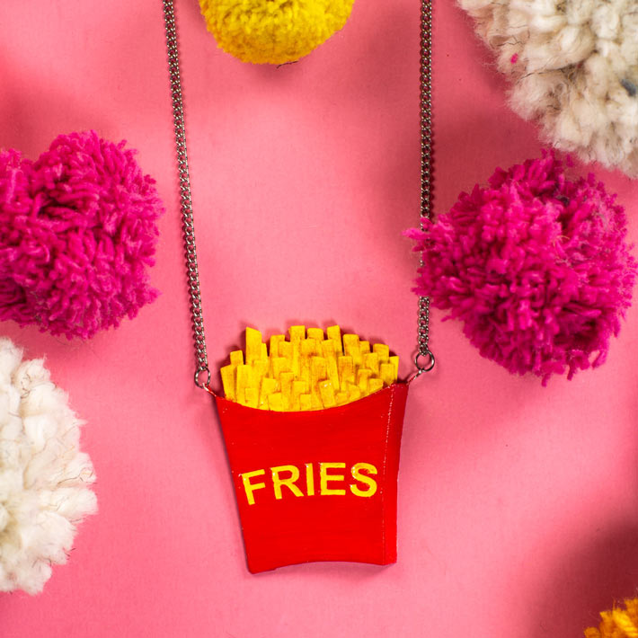 French Fries Necklace on pink background