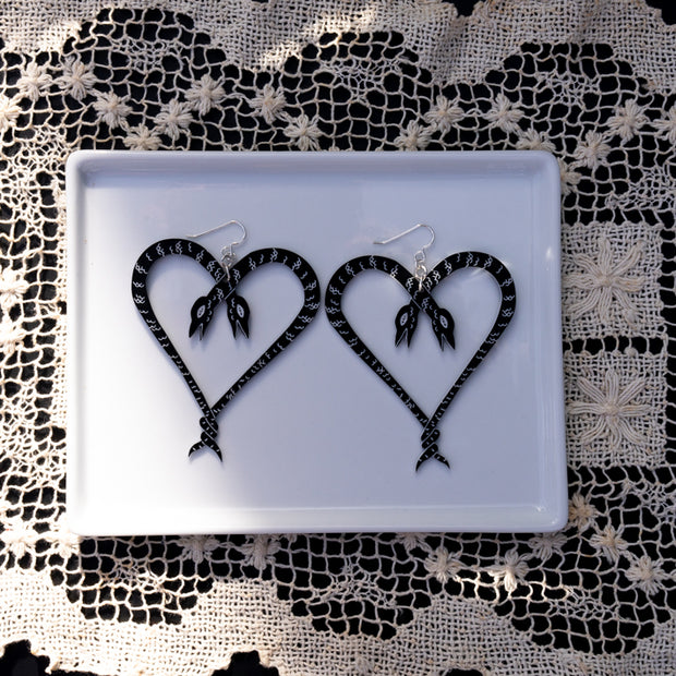 Large Heart of Snakes Earrings on white tray
