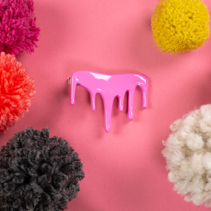 Pink drip tie clip on pink background