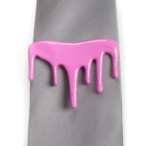 Pink drip tie clip on wide gray tie
