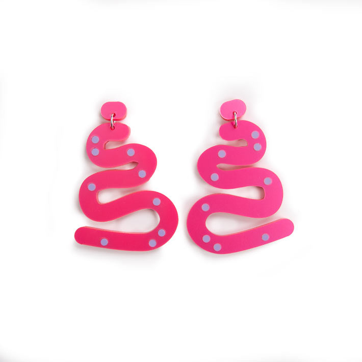 hot pink squiggle earrings over white