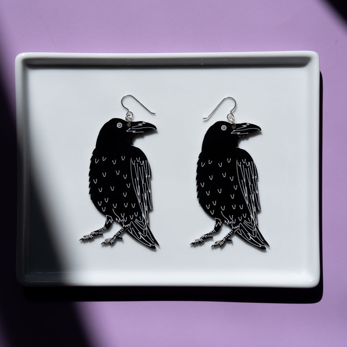 large raven skeleton earrings, raven side shown