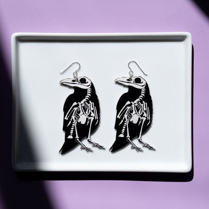 Large Raven skeleton earrings, skeleton earring side shown