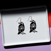 Small raven skeleton earrings, skeleton side shown