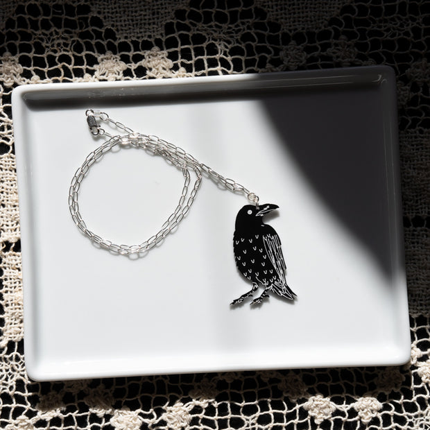 Raven skeleton pendant necklace, raven side shown