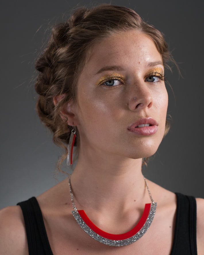 Red and silver smile necklace on model