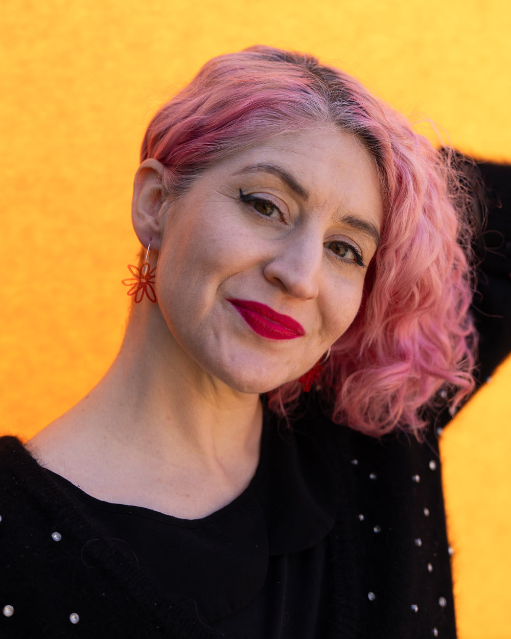 red orange flower hoop earrings  on model