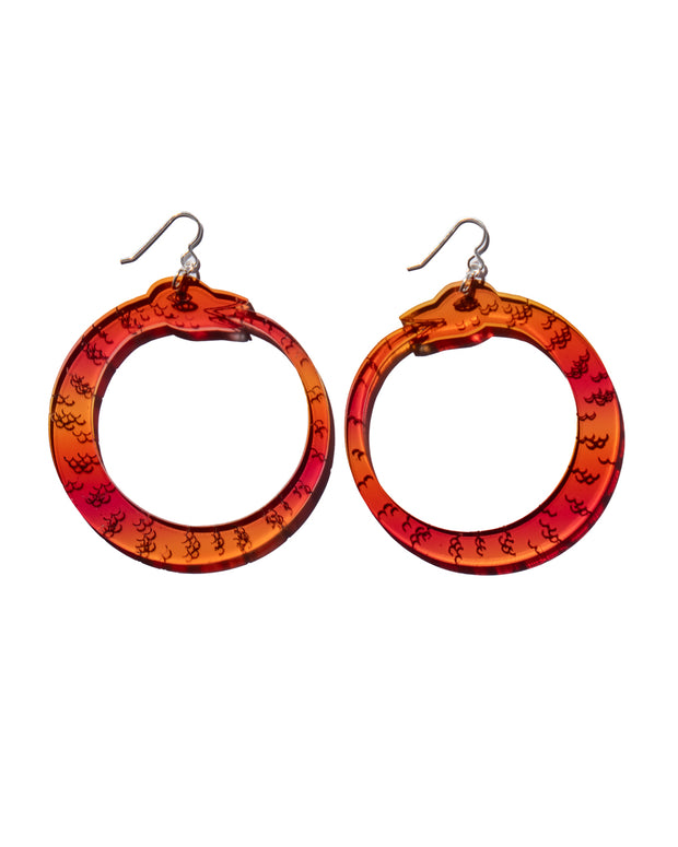 red orange ouroboros earrings on white background