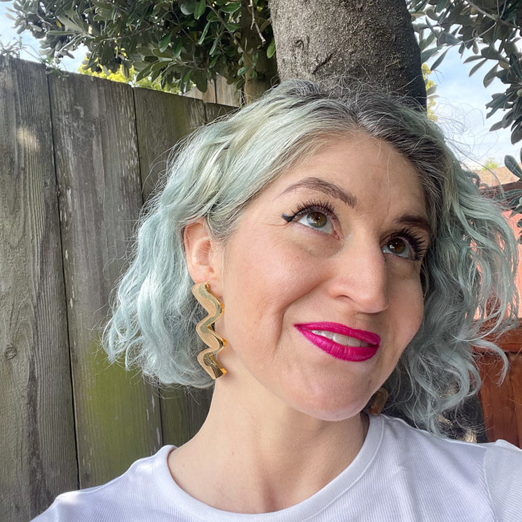 Model wearing Gold Acrylic earrings