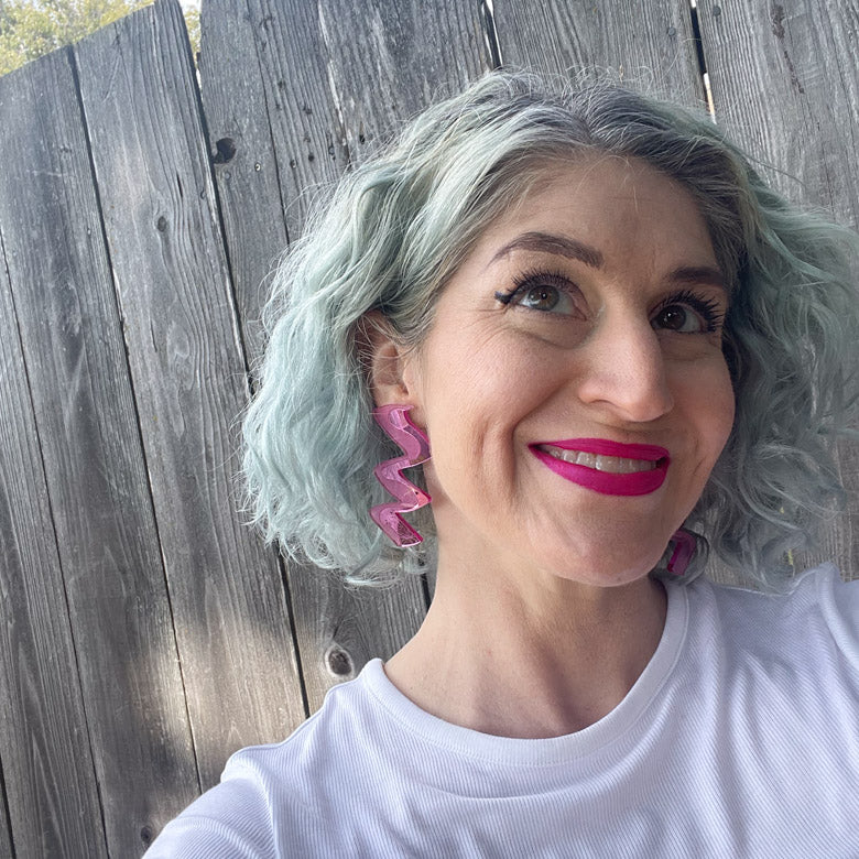 Model wearing Zigzag pink acrylic earrings