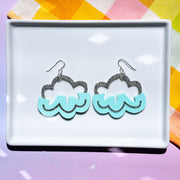 Aqua cloud earrings on white tray