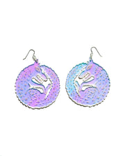 Large wolf earrings over white background