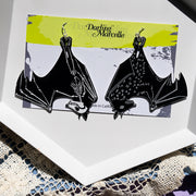 large black bat earrings shown on earring card