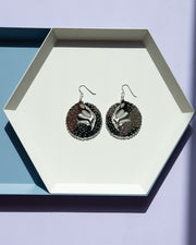 Small mirrored wolf earrings in geometric tray