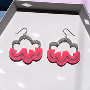 pink cloud earrings on white tray