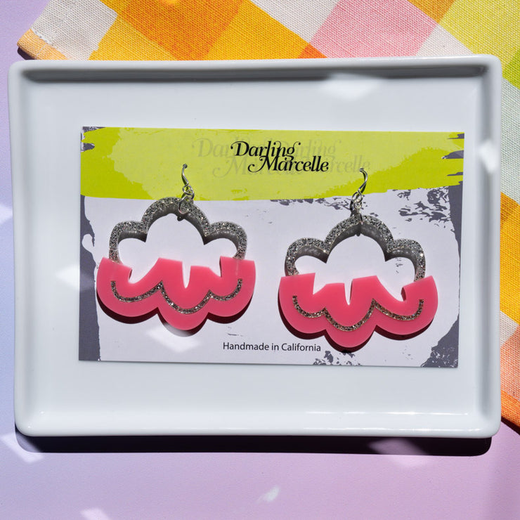 pink cloud earrings packaged on a Darling Marcelle card atop a white tray