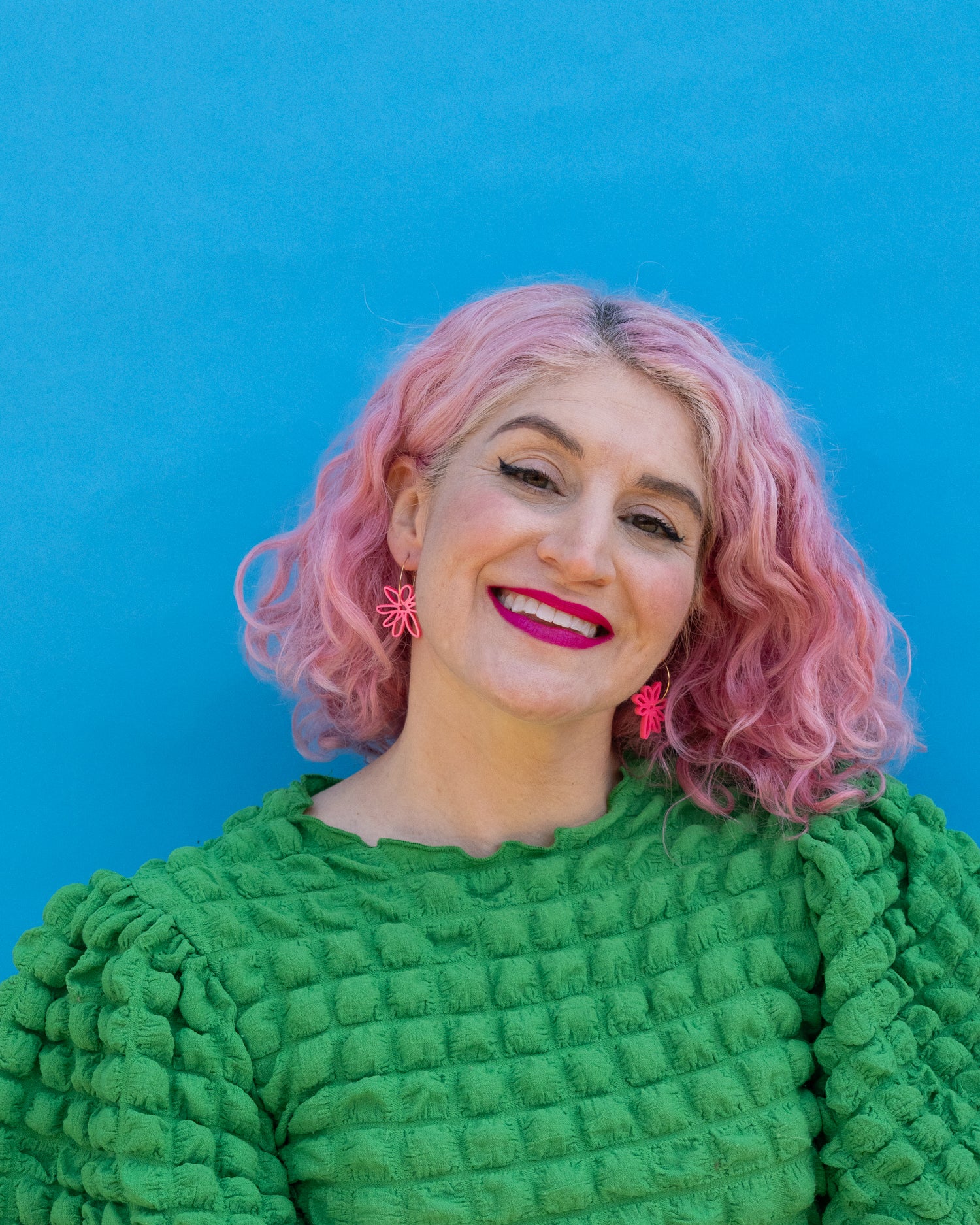 pink flower hoop earrings shown on model