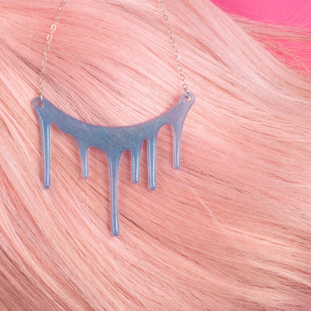 translucent blue necklace on pink hair