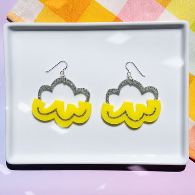 yellow cloud earrings on white tray