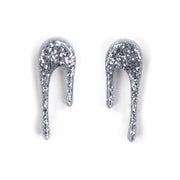 sparkly silver stud earrings over white