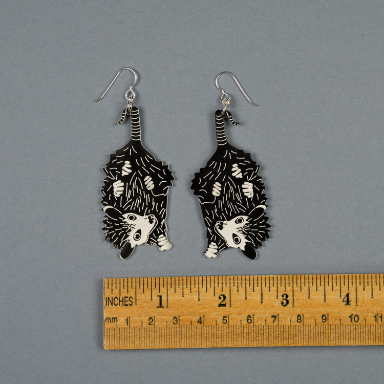 Small Baby Possum Earrings shown above ruler