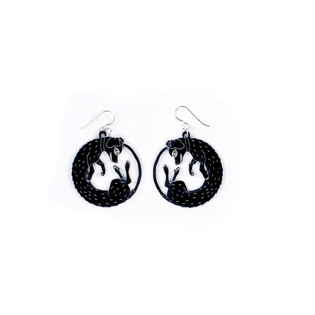 small black dog earrings on white background