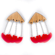 wood and red dangle earrings over white