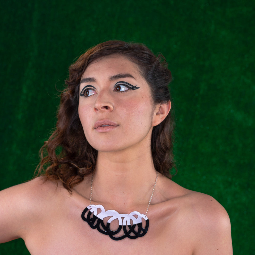 Chunky black & lilac statement necklace on model