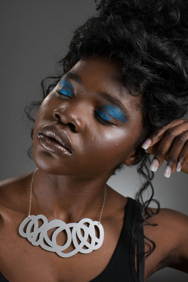 chunky silver statement necklace shown on model