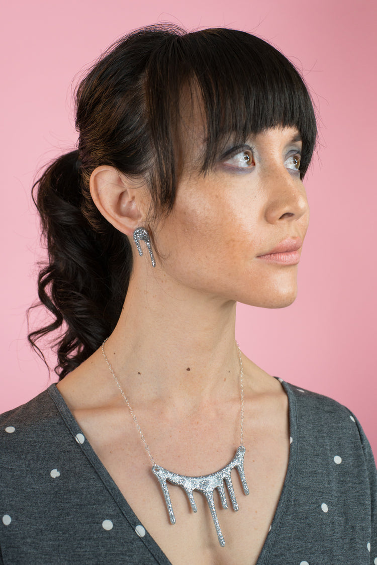 sparkly silver necklace on model