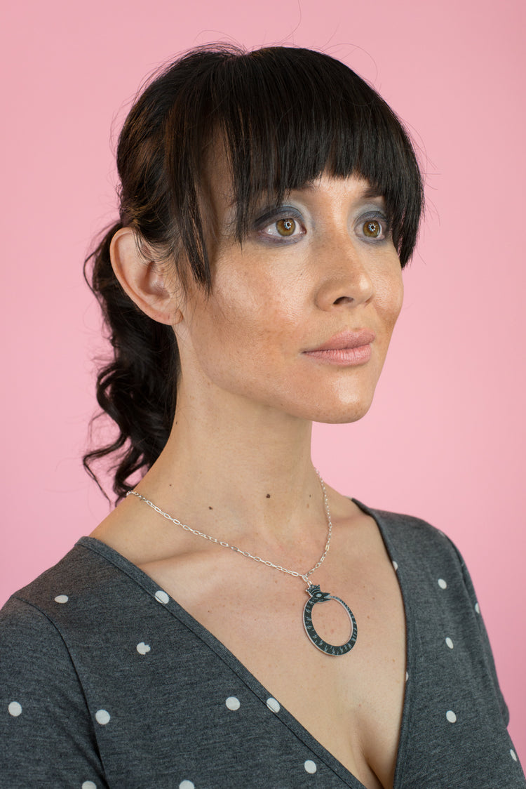 ouroboros necklace on model