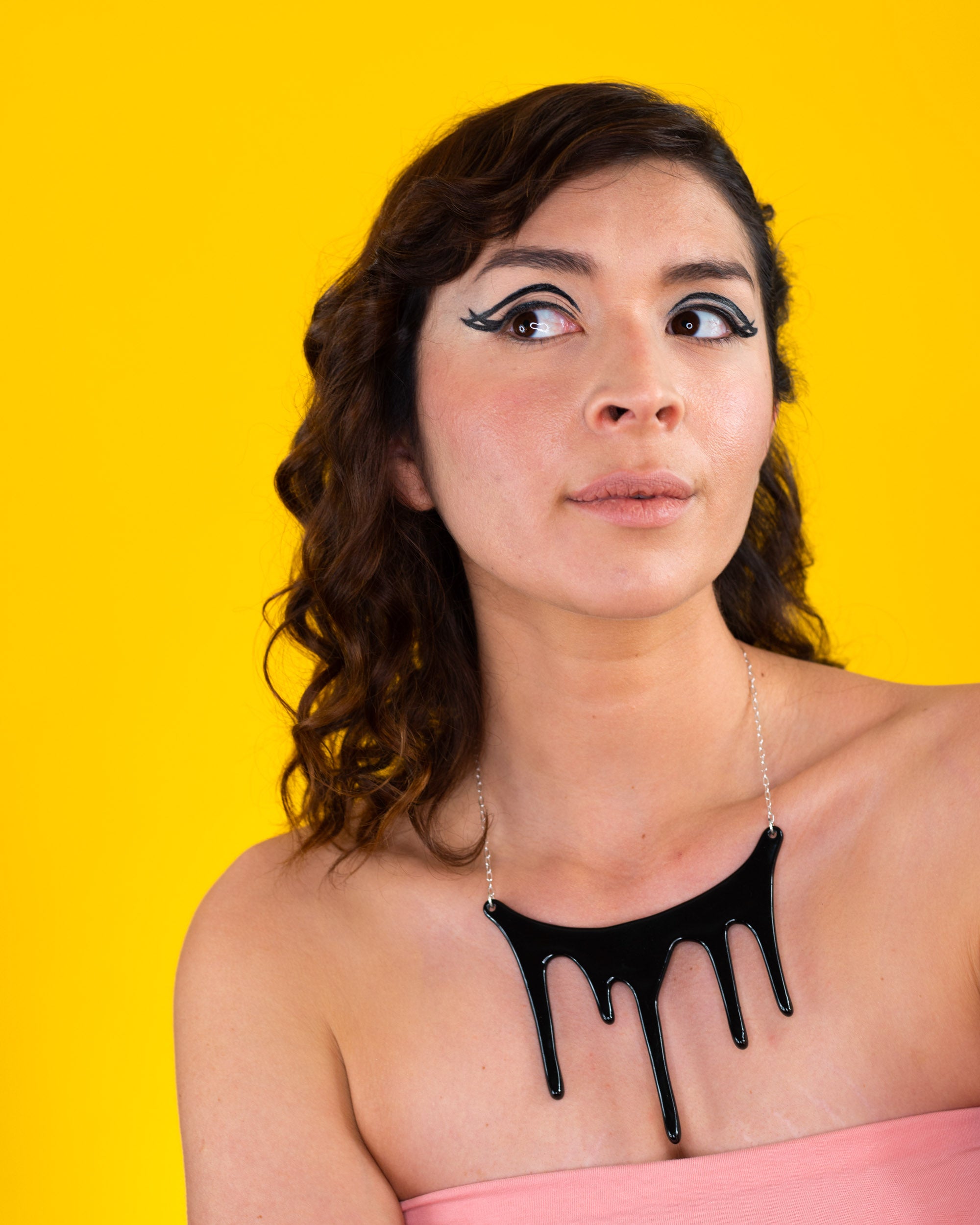 black statement necklace on model