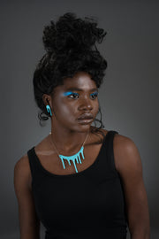 droplet blue stud earrings and necklace on model
