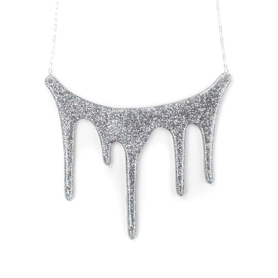 drip silver statement necklace over white