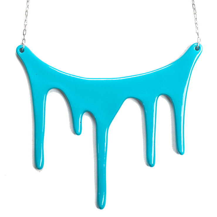drip blue statement necklace over white
