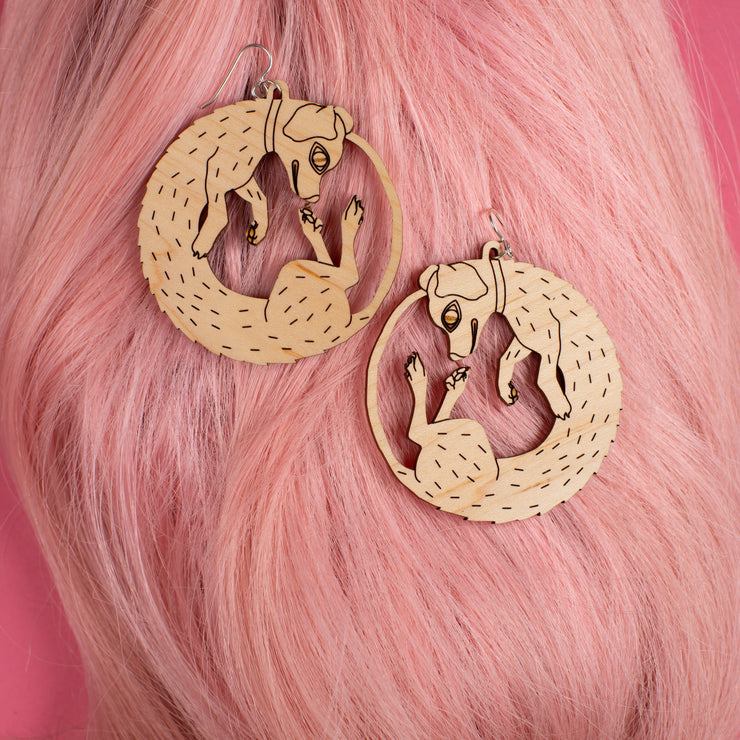 large wood dog earrings on pink wig