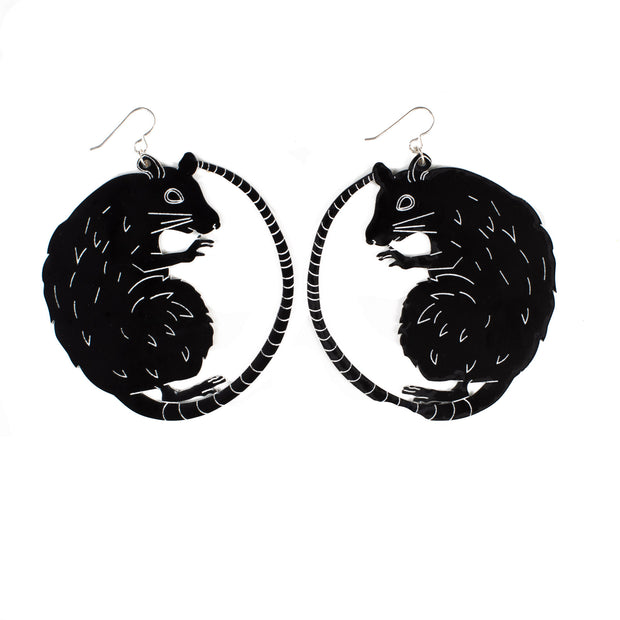 large black rat earrings on white background