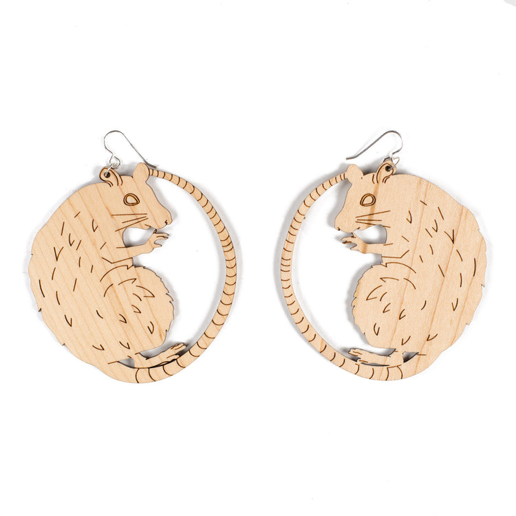 large wood rat earrings over white