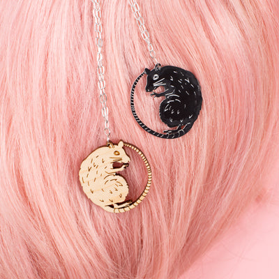 wood rat necklace & black rat necklace on pink wig