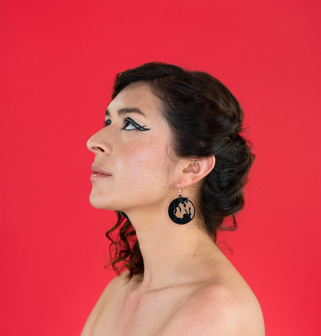 small black dog earrings on model