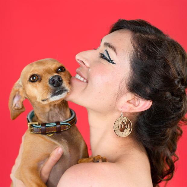small wood dog earrings on model with chiweenie