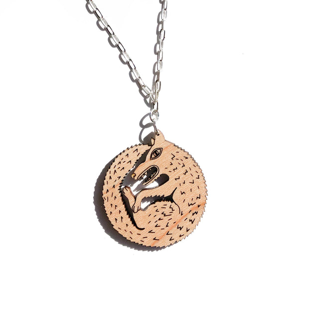 wood wolf necklace on white background