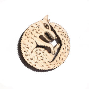 wood wolf pin on white background