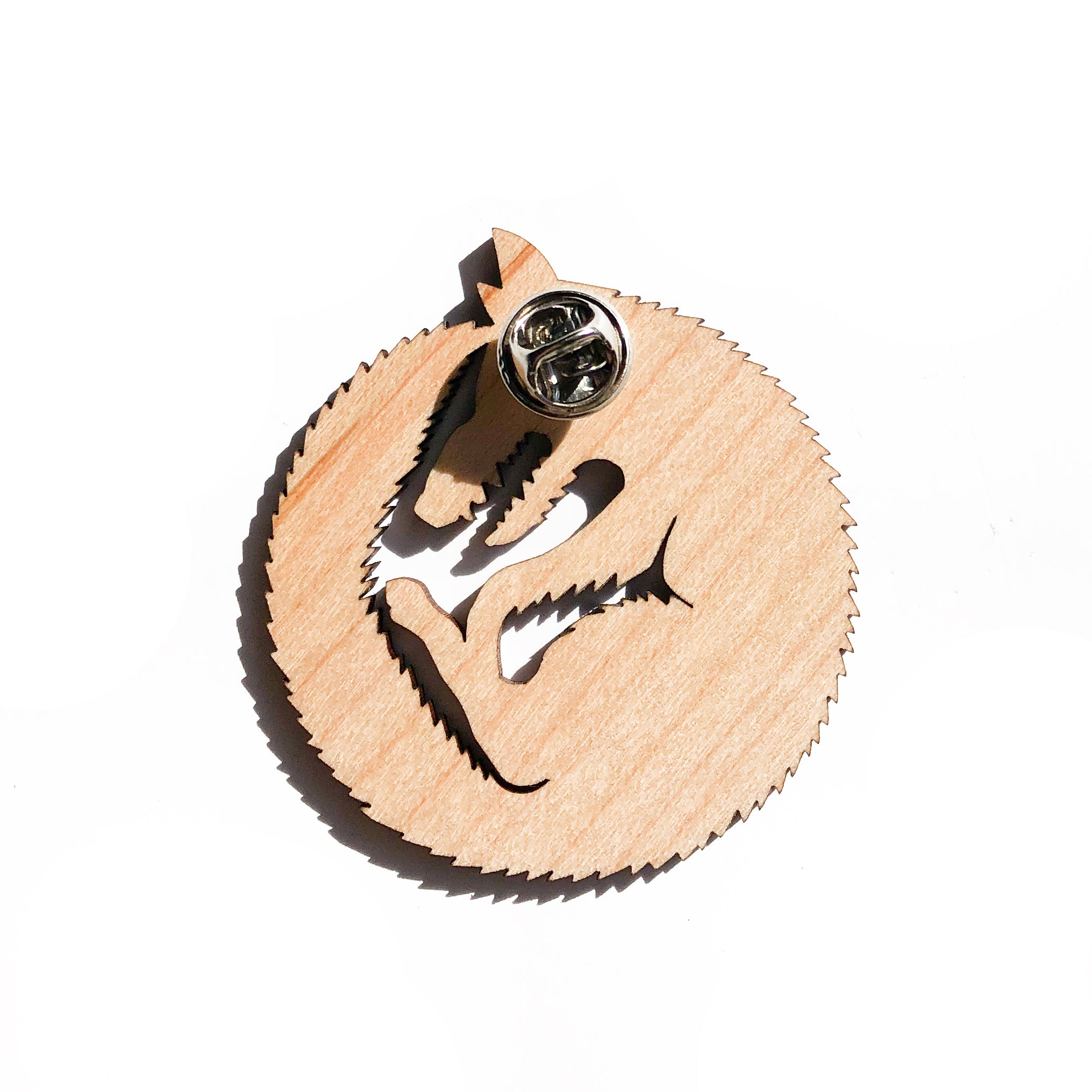 back of wood wolf pin