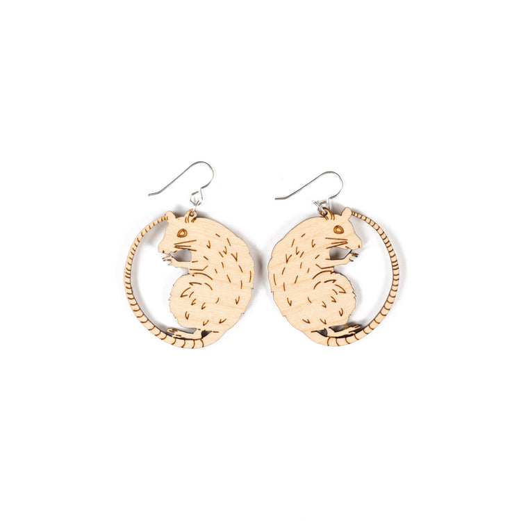 small wood rat earrings on white background