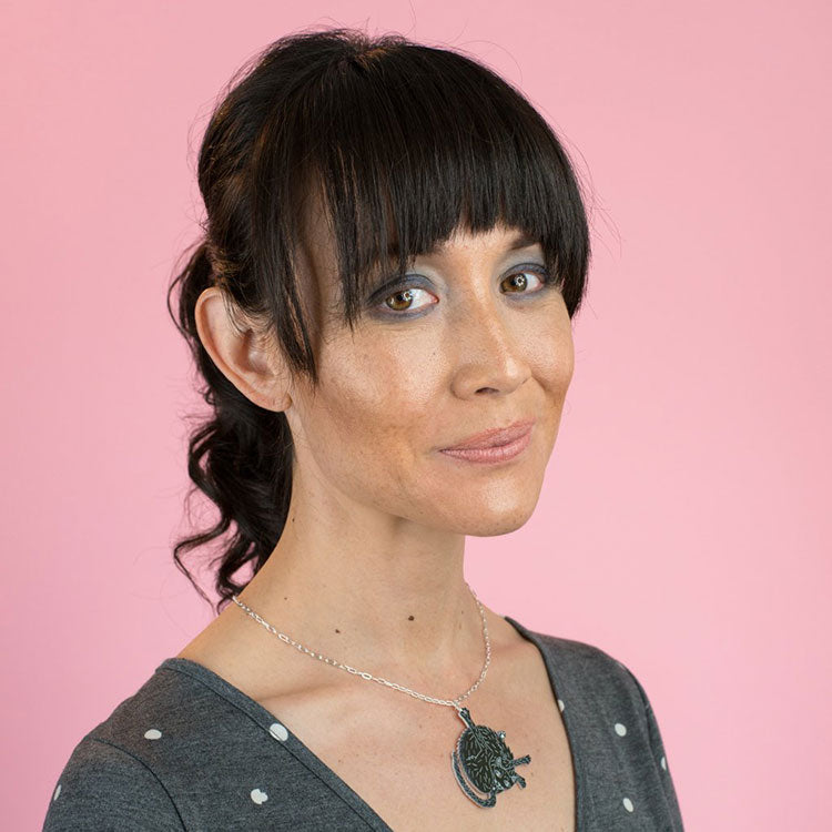 black cat necklace on model