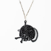black cat necklace over white